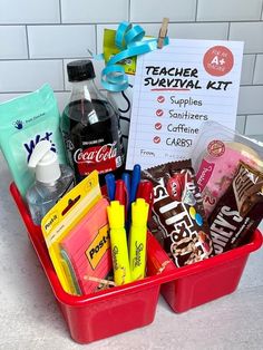 the teacher survival kit is in a red container with markers, pens and other school supplies