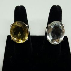 24mm Faceted Oval Yellow Quartz Ring Size 7 Or 26mm Faceted Oval Clear Quartz Ring Size 8. Both Set In 925 Silver With Prongs And Double Bezel. Oval Citrine Ring With Large Stone, Yellow Oval Gemstones With Accent Stones, Oval Yellow Citrine Gemstones, Yellow Oval Faceted Jewelry, Classic Yellow Faceted Rings, Clear Quartz Ring, Cubic Zirconia Engagement Rings, Yellow Quartz, Cushion Cut Ring