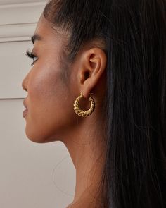 These smaller hoop earrings feature a classic twisted cable design, offering an elegant look perfect for any occasion. Hand-polished and quality inspected for perfection, they come in yellow gold or white gold plated over sterling silver. Choose the color that complements your style. Ideal as a gift for her, gift for mom, or a best friend gift. Closure: Hoop Stamp Approx. Measurement: Outer Length: 1.1 inches Outer Width: 1 inch Silver Weight: Approx. 0.2 oz Modern Twisted Jewelry For Everyday, Everyday Twisted Hoop Earrings, Modern Twist Hypoallergenic Hoop Earrings, Modern Twist Hypoallergenic Hoop Earrings As Gift, Modern Twist Hypoallergenic Hoop Earrings For Gifts, Trendy Yellow Gold Hoop Earrings For Anniversary, Tarnish Resistant Twisted Jewelry, Modern Twist Hoop Earrings As Gift With Polished Finish, Modern Twist Polished Hoop Earrings As Gift