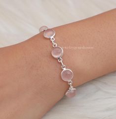 Rose Quartz Bracelet, 925 Sterling Silver Bracelet, January Birthstone, Handmade Bracelet, Adjustable Bracelet, Boho Jewelry, Gift For Women Gemstone - Rose Quartz  Stone Quality - AAA  Weight - 8.28  gm  Stone Length- 0.8 cm, Stone Width - 0.8 cm Bracelet Length - 6 inch to 9 inch sizes are available, we give 0.5 inch adjustable in the size which you order ( NOTE - 0.5 INCH ADJUSTABLE IS INCLUDED IN YOUR ORDERED SIZE ) Stone Shape - As shown in the picture We serve complete 925 sterling silver Jewelry and genuine properties of the stone. The products are dispatched from the small business from UK. Product Quality and Packaging - Our all products are 925 Silver Stamped which shows that the product is genuine and authentic .The products are dispatched from the small business from UK so you Sterling Silver Round Crystal Bracelet Gift, Pink Sterling Silver Round Bracelets, Pink Round Sterling Silver Bracelets, Pink Gemstone Sterling Silver Bracelet, Pink Sterling Silver Round Bracelet, Pink Sterling Silver Bracelet, Adjustable Round Rose Quartz Jewelry, Silver Rose Quartz Bracelets As Gift, Silver Rose Quartz Bracelets For Gifts