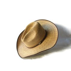 "This 4X quality US size 7 1/2 Atwood \"Trail Rider\" plaited palm cowboy hat has a Gus Crease crown that rises 5 1/2\", a 4\" brim that is trimmed with grosgrain, and a 1 3/4\" height comfort sweatband... ready for a hard day's work in the sun, or a night on the town!" Western Style Rigid Straw Hat For Rodeo, Western Brown Panama Hat, Western Style Brown Panama Hat, Western Panama Hat With Curved Brim For Country Events, Western Brimmed Panama Hat For Country Events, Western Straw Hat With Flat Brim For Ranch, Western Fedora Panama Hat For Ranch, Classic Curved Brim Sun Hat For Western-themed Events, Western Style Straw Hat For Ranch