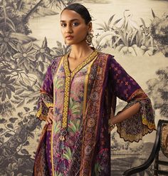 Editor's Note Featuring an a-line suit with bell sleeves beautifully hand crafted and embroidered on the front yoke. It is styled with a co-ordinated printed dupatta and straight pants. Fabric: Kurta: crepe, pants: cotton silk, dupatta: tabby silk Color: Purple Components: Kurta, pant and dupatta Occasion: Festive Care: Dry Clean Only About the Designer Kalista is a luxury fashion label that specializes in designer clothing for millennial women. Founded by fashion designer turned entrepreneur, P Pants Crochet, Blouse Yoke, Crepe Pants, Printed Dupatta, A Line Kurta, Checkered Print, Checker Print, Lace Border, Hand Work