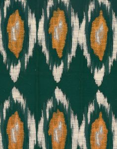 an orange and green pattern on fabric