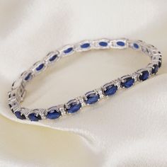 Blue Sapphire Bracelet, Diamond Bracelet, Tennis Bracelet, Gemstone Bracelet, Wedding Engagement Bracelet, Gift For Her, Party Wear Bracelet. Blue Sapphire bracelet diamond looks western and stylish modular design bracelet is make in 925 sterling silver base metal . all types of customization are available we can customize these as per the requirements also . These blue sapphire and white diamond is a suitable for all types of skin tones . also you can wear these as per your any outfits . specia Sapphire Cubic Zirconia Bracelets, Wedding Sapphire Diamond Bracelet With 17 Jewels, Sapphire Bangle Bracelet For Formal Occasions, Sapphire Diamond Bracelet For Wedding, Sapphire Jubilee Bracelet, Formal Sapphire Bracelet, Blue Bangle Tennis Bracelet For Formal Occasions, Blue Jubilee Bangle Tennis Bracelet, Fine Jewelry Sapphire Bangle Bracelet