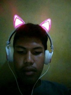 a man wearing headphones with glowing ears