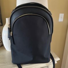 Pristine Condition, Never Used Just Sitting In A Closet. Stylish Triple Zipper Backpack, Perfect For Every Day Use And Travel. Lightweight Waterproof Fabric, And Lining To Keep All Your Stuff Dry Zippers Glide, Smooth, And Easily Breathable Back Panel And Ergonomic Padded Shoulder Straps For Comfort Details & Dimensions 11.6” Width X 17.3” High X 3.9” Deep Capacity 13l Weight 2.4 Lbs Laptop Pocket 14.2” X 10.2” Fits Up To 16” Macbook Elegant Backpack With Zipper Pocket, Elegant Everyday Backpack With Zipper Pocket, Elegant Leather Backpack With Zipper Pocket For Daily Use, Elegant Backpack With Adjustable Strap For School, Elegant Leather Backpack With Zipper Pocket, Elegant Leather Backpack With Zipper For School, Elegant Leather Backpack With Zipper Closure, Elegant Leather Backpack With Zipper, Black Backpack With Zipper Closure For Office