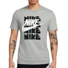 Logo-Topped Tee By Nike Cut From 100% Cotton In A Standard Fit With Short Sleeves & Ribbed Knit Crew Neck. Content + Care - 100% Cotton - Machine Wash - Imported Size + Fit - Measurements Taken From Size Large - Chest: 22” - Length: 29” Purchased At Urban Outfitters. Gray Sportswear Tops For Spring, Gray Spring Sportswear Tops, Nike Sporty Top With Logo, Sporty Nike Top With Logo, Nike Cotton Top With Logo, Nike Cotton Tops With Logo, Sporty Spring Shirt With Letter Print, Casual Sports Shirt For Spring, Sports Crew Neck Top With Logo