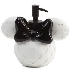 a soap dispenser with a black bow on it's head and hearts