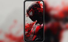 an image of spider man on the back of a cell phone with red paint splattered over it