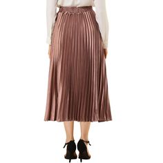 Accordion pleats enhance the dimension and movement of this midi skirt, while the metallic design underscores its sleek style. It's pleated all around for this trending midi skirt. Feel free to pair it with black block-heel sandals. Whether your dressing up or down, this skirt is perfect for any occasion. A casual and simple style, never out of fashion, is a must-have item in your wardrobe. Spring Night-out Skirt With Folds, Spring Night Out Skirt With Folds, Full Pleated Skirt With Accordion Pleats For Night Out, Spring Party Skirt With Folds, Night Out Pleated Midi Skirt, Pleated Midi Skirt For Party, Chic Pleated Skirt With Pleated Back For Party, Evening Accordion Pleats Pleated Skirt For Fall, Black Midi Skirt With Accordion Pleats For Night Out