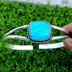 "Welcome in KSBJewels -------------------------------------------------------------------------- Title : Blue Australian Opal Bangle, 925 Sterling Silver Bangle, Handmade Bangle, Gift For Her, Split Band Bangle, Anniversary Gift, Boho Bangle Special offers for you :-  1) If you want to Buy BULK QUANTITY products from us, We can make *SPECIAL OFFER* for you. [BUY 50 GET 10 FREE] -------------------------------------------------------------------------- NOTE :- STONE MAY BE LITTLE DIFFERENT and MEASUREMENTS & WEIGHT are CLOSE to APPROXIMATES. \"It'll look beautiful when you wear it\" Meterial-925 Sterling Silver Click Here to visit my Home Page:- https://www.etsy.com/in-en/shop/KSBJewels?ref=seller-platform-mcnav I gladly accept CUSTOM ORDER if any, contact us freely. YOUR SATISFACTION- OUR Adjustable Blue Cuff Bracelet Stamped 925, Adjustable Green Sterling Silver Bracelet Gift, Opal Bangle, Boho Bangle, Sports Jewelry, Sterling Silver Bangle, Turquoise Bracelet Cuff, Handmade Bangles, Silver Bangle