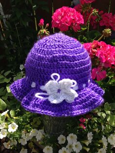 This Sun Hat just too cute! Handmade purple grape color Floppy Sun Hat, with sparkly silver trim and a white sparkle flower, made with simply soft and light yarn. This is a Great All Season hat for your little ones! It's perfect for a baby who doesn't have a lot of hair, and need to keep the sun off their head.  This Sun Hat is perfect for Toddler or Child to keep the sun out of their face. This hat is machine washable too!  We can custom made this Hat in any size (newborn-Child) or color. We also can do Teen and Adult size for $20.00. Please Convo's when ordering.  Thank You for Visiting The Sand Dollar Co Floppy Sun Hat, Grape Color, Floppy Hats, Floppy Sun Hats, Baby Box, Toddler Hat, Purple Grapes, Sand Dollar, Bucket Hats