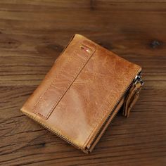 This wallet is more than just a choice—it’s an essential accessory for the modern man. Crafted from genuine leather, it features a classic bi-fold design with a card holder, coin pocket, and double zipper for secure and organized storage. With its casual style and practical functionality, this wallet is a must-have accessory. Organized Storage, Small Wallet, Modern Man, Casual Style, The Modern, Card Holder, Coin, Genuine Leather, Wallet