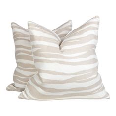 two zebra print pillows sitting on top of each other