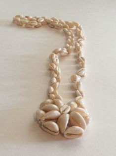 "Vintage shell necklace. The wonderful piece has an incorporated shell medallion. The piece measures 16\". It shows minor age and wear. It's in good overall vintage condition. It does not have any maker marks or tags. There is not a clasp. Fun statement piece.  Shipping is included in the price. (Shipping may be listed as free- but of course its not really free...) We believe in transparency and honesty even in marketing and want you to know we are just including shipping in your purchase price. Vintage Shell Necklace For Beach, Vintage Handmade Shell Necklaces, Vintage White Shell Necklace, Vintage Shell-shaped Necklaces For Gifts, Bohemian Adjustable Shell-shaped Necklace, Tacoma Wa, Shell Necklace, Shell Necklaces, Save You