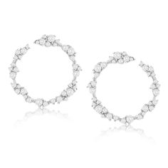 Add the perfect amount of sparkle to your ears with these white cubic zirconia open circle cluster earrings. These beautiful earrings features prong set white round cut cubic zirconia in an unique cluster floral design. When wearing these earrings, they will hang on your ears and will create shimmer and shine from every angle. These earrings are hand set in 925 sterling silver with a high polish finish. Surprise someone special in your life with these luxurious earrings. The perfect gift that is Luxurious Earrings, Gemstone Brooch, Cubic Zirconia Bracelet, Shimmer And Shine, Cubic Zirconia Necklace, Luxury Earrings, Cubic Zirconia Jewelry, Cubic Zirconia Earrings, Creating Jewelry