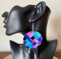 Make a bold, fabulous statement with these colorful lightweight geometric inspired earrings! This one-of-a-kind jewelry works with a wide range of outfits. The earrings were created with 100% cotton fabric and wood.  Fabric is on both side of earrings. Circle measures 2.25" x 2.25". All of our pieces are handmade in our design studio with careful attention to detail and durability.  Additional options available in our shop's Earrings  section. Every set arrives gift wrapped in our signature box.  Orders ship within 1-3 business days.  Domestic US orders include free shipping & tracking.  If you like what you see, please favorite our shop and share with your friends! Please message us below with any questions at Anzhlay Designs. https://www.etsy.com/shop/anzhlaydesigns Bold Geometric Earrings With Bold Design, Bold Geometric Designed Earrings, Bold Geometric Earrings, Unique Multicolor Geometric Jewelry, Modern Multicolor Geometric Jewelry, Modern Multicolor Single Earring, Bold Drop Earrings With Bold Design, Modern Multicolor Jewelry With Bold Design, Modern Multicolor Earrings With Bold Design