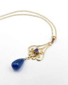 "Antique vintage 14k gold chain and 10k gold natural blue stone pendant necklace, In good antique vintage condition. Necklace 19\" long. Antique pendant circa 1910's. Pendant 1\" ¾ long ½ wide. Blue tear drop stone 10 mm x 6 mm. Weighs 2.5 gram. Marked 14k on the clasp. Thanks." Antique Blue Necklaces For Formal Occasions, Antique Blue Filigree Necklace, Victorian Blue Necklaces For Formal Occasions, Blue Victorian Necklace For Formal Occasions, Victorian Blue Filigree Necklace, Victorian Style Blue Necklaces For Formal Occasions, Antique Blue Gemstone Necklaces, Vintage 14k Gold Blue Jewelry, Vintage Blue 14k Gold Jewelry