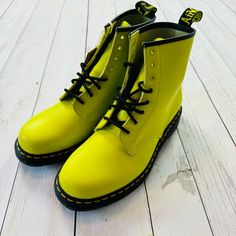 Dr. Martens 1460 Neon Sulphur Green Smooth Leather Boot Iconic 8-Eye Ultra-Bright Neon Leather Grooved Sides Heel Loop Yellow Welt Stitching Air-Cushioned Sole With Good Abrasion Slip Resistance Heel: 1.25"H Mens Us Size 11 Womens Size 12 Condition: New Without Tags. It Shows A Couple Of Minor Scuffs (Hardly Noticeable Though) Please Refer To All Pictures To Get A Better Idea Green Boots With Rubber Sole For Spring, Yellow Boots For Streetwear, Yellow High-top Boots For Streetwear, High-top Yellow Boots For Spring, Yellow Fitted Boots With Round Toe, Classic Yellow Boots With Round Toe, Classic Yellow Round Toe Boots, Classic Yellow Lace-up Boots, Yellow Boots With Rubber Sole For Fall