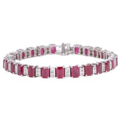 22 Carat Ruby and Diamond Tennis Bracelet Rubies - Carat - Approx 22 Carats Shape - Emerald Cut Color - Red Diamonds - Carat - Approx 1.50cttw Color - F/G Clarity - VS 14 Karat White Gold Length - 7 Inches Luxury Red Tennis Bracelet For Wedding, Luxury Red Women's Tennis Bracelet, Luxury Red Diamond Bracelet For Formal Occasions, Formal Red Diamond Bracelet, Luxury Red Diamond Bracelet For Anniversary, Red Diamond Bracelet For Formal Occasions, Fine Jewelry Red Diamond Bracelet For Formal Occasions, Formal Red Diamond Bracelets, Luxury Red Tennis Bracelet For Anniversary