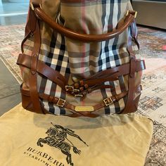 This Is A One Owner Bag Bought From Burberry In Nashville. Great Condition! Classic Burberry Canvas Print And Leather. Black Canvas Liner In Perfect Condition. 15” Long Let Me Know If You Need Any Other Information Black Canvas, Burberry Bag, Let Me Know, Nashville, Burberry, Canvas Print, Let Me, Bag Lady, Canvas Prints