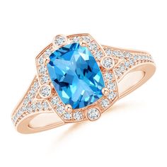 a blue topazte and diamond ring in 18k rose gold with white diamonds