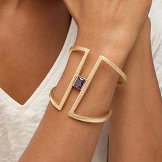 MarlaWynne Minimalist Accent Stone Wide Cuff Bracelet Drab duds who? Not you. Freshen up those old familiar fashions. Accessorize with this modern cuff's bold, yet spacious silhouette featuring a split  design and purple solitaire.       S/M approx. 6-5/8"L      M/L approx. 6-3/4"L     Approx. 2-9/16"W     Worn finish      Tapered back; hinged Modern Cuff Bracelet, Cuff Bracelets Gold, Statement Cuff Bracelet, Wide Cuff Bracelets, Split Design, Gold Bracelet Cuff, Ancient Jewelry, Wide Cuff, Geometric Jewelry