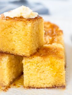 several pieces of cake sitting on top of a white plate with whipped cream in the middle