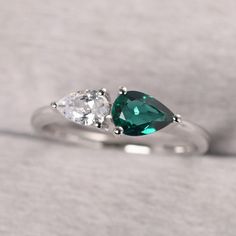 ◆ The ring is handcrafted from sterling silver and decorated with a dazzling 7*5 mm lab emerald and 6*4 mm CZ. It is suitable for engagement/anniversary/daily occasion. ◆ Production Description: Main stone Type: Lab emerald and CZ Main Stone Shape: Pear Cut Main Stone Size: 7x5 mm(0.73 ct) and 6x4 mm(0.65 ct) Side stone: None Metal: 925 Sterling silver - Other options available in the drop down menu ◆ Customization: √Free for Add Engraving √Other Metal Type Available √Other Gemstones & Shapes Av Couples Birthstone Ring, Couple Birthstone Ring, Silver Setting Pear-shaped Emerald Promise Ring, Silver Pear-shaped Emerald Promise Ring, Elegant Teardrop Emerald Ring In Silver, Elegant Silver Teardrop Emerald Ring, Pear-shaped Silver Emerald Promise Ring, Silver Pear-shaped Emerald Ring For Anniversary, Silver Emerald Ring With Brilliant Pear Cut