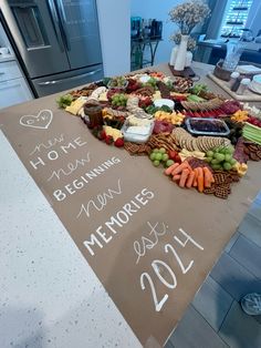 a table with a sign that says happy new year and lots of food on it