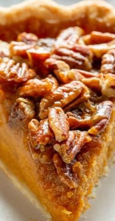 a slice of pecan pie on a white plate