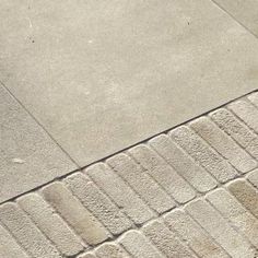 a person riding a skateboard down a sidewalk