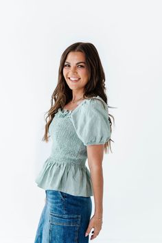 Features Square neckline with ruffle detailing Short sleeve with elastic Smocked bust Sage color 100% Cotton Size + Fit Small 0-4, Medium 4-8, Large 8-12 Kristin is 5'4", a size 1 and is wearing a Small Runs true to size Click here for skirt shown in photos Curvy Swim, Sage Color, Smocked Top, Curvy Dress, Resort Collection, Swim Bottoms, Square Neckline, Skirt Pants, Sweater Jacket