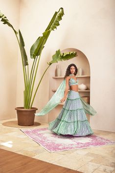 Elevate your ethnic charm with our exquisite flowy fabric lehenga. The light cancan adds a graceful sway to every step, while the back chain detail adds a touch of allure. The gathered blouse complements the lehenga beautifully, and the stole-style dupatta, attached at the center with an embroidered panel, completes the ensemble with a perfect blend of tradition and modern elegance. Please note the belts added on the above styles are to be sold separately and are not a part of the outfit, these Bohemian Sharara With Cutdana For Reception, Bohemian Georgette Dress For Reception, Bohemian Anarkali Set With Sheer Dupatta, Blue Bohemian Sharara For Reception, Bohemian Georgette Sharara For Reception, Bohemian Floor-length Sharara With Sheer Dupatta, Bohemian Georgette Choli For Navratri, Bohemian Choli With Sheer Dupatta For Festive Season, Bohemian Dress For Navratri Reception