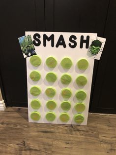 there is a sign that says smash on the front door with green circles around it