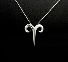 Are you a born Aries or someone you care for is? Then you must know that are Aries are independent and courageous, but also short tempered and impatient. The loop is placed a bit to the left side to create balance between the two sides which have a difference in weight, due to the amount of silver used in each horn. The left side is a bit heavier. This Aries mask symbol with two different sides represent the more subtle and also more rough personality of those beautiful people under the sign of Aries Jewelry, Zodiac Sign Jewelry, Aries Necklace, Aries Zodiac Sign, Astrology Necklace, Ram Horns, Zodiac Sign Necklace, Tattoos Skull, Horn Jewelry