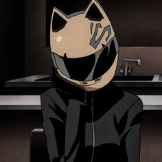 a person wearing a cat mask sitting in front of a counter top with a sink