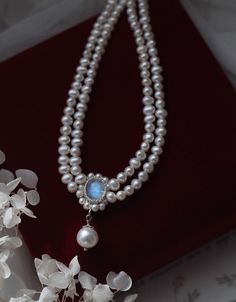 This is a French vintage double strands freshwater pearl necklace We use hand-woven natural moonstone with bright pearls.Material: 4-5mm nearly round natural freshwater pearl /9-10mm nearly round/or teardrop-shaped natural large pearl /7*9mm natural moonstone/ 14K goldThe winding part is also made of natural shaped pearls, which look unimpressive but not easy to hand made.We offer two lengths for you:32 +4cm extension chain34 +4cm extension chainPlease note that the luster of the moonstone is mo Handmade Double Strand Pearl Jewelry, Pearl Necklace With Gemstone Round Beads, Handmade Double Strand Pearl Necklace, Elegant Double Strand Pearl Necklace With Natural Stones, Double Strand Pearl Necklace With Natural Stones, Elegant Moonstone Beaded Necklaces, Handmade Akoya Pearl Necklace With Round Beads, Double Strand Pearl Necklace Gift, Double Strand Gemstone Pearl Necklace Gift