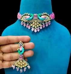 Beautiful peacock designer statement choker set. Kundan, AD and monalisa stones make its look beautiful. Gold plated with Victorian polish. Hand meena work . If have any queries please ask Brass Jewelry With Peacock Design For Festivals, Festive Brass Jewelry With Peacock Design, Elegant Multicolor Peacock Design Jewelry, Elegant Pink Jewelry With Peacock Design, Elegant Pink Peacock Design Jewelry, Festive Multicolor Brass Jewelry, Multicolor Peacock Design Temple Jewelry Sets, Metal Jewelry With Peacock Design For Party, Multicolor Meenakari Brass Jewelry