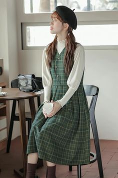 Pinafore dress with a v-neckline, curved button-front, side pockets and a midi skirt. S: 34.5" chest and waist, 42" lengthM: 36" chest and waist, 42" lengthL: 37.5" chest and waist, 42" length Midi Dress Green, Pinafore Dress, Green Midi Dress, Shoe Gifts, Overall Dress, Sweater Blouse, Cardigan Jacket, Jeans Pants, Sweaters & Cardigans