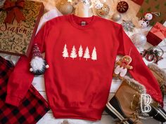 Christmas Tree Sweatshirt, Red Christmas Pullover, Simple Christmas Sweatshirt, Evergreen Sweatshirt, Pine Tree Sweatshirt, Women Christmas Evergreen Trees Shirt Sweatshirt - Red + This sweatshirt has a loose fit, medium-heavy fabric made from 50% polyester and 50% cotton. It is printed with DTG (direct-to-garment) technology using ink that is safe to print on children's clothing and reduces environmental waste. DTG prints have a slightly faded or washed look. + For sizing and dimensions, please Christmas Hoodies Design, Grinch Sweatshirt, Disney Couple Shirts, Disney Christmas Shirts, Grinch Shirts, Disney Trip Shirts, Cute Christmas Shirts, Disneyland Shirts, Funny Christmas Sweaters