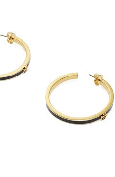 A signature double-T ornament charms the curves of these enamel-trimmed hoops that add a subtle splash of elegance to your lobes. Post back 1 5/8" hoop diameter 18k-gold plate/enamel/crystal Imported Elegant Enamel Hoop Jewelry, Elegant Enamel Hoop Earrings, Small Elegant Enamel Hoop Earrings, Black Enamel Hoop Earrings, Tory Burch Kira, A Signature, Gold Black, Tory Burch, 18k Gold