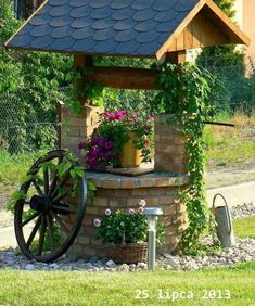 an old wagon with flowers growing out of it