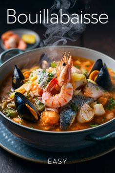 Steaming bowl of bouillabaisse with various seafood and vegetables. Seafood Medley Soup, Seafood Boulibaisse Recipe, France Food Recipe, Boulibaisse Recipe, Cataplana Recipes, Seafood Mix Recipes, Charleston Recipes, Seafood Bouillabaisse, France Recipes