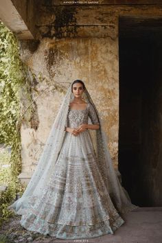 a woman in a white and blue bridal gown