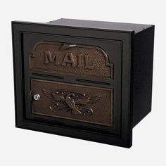 the mailbox has two letters on it and is black with an eagle emblem in front