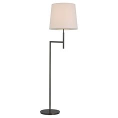 a floor lamp with a white shade on the base and a black metal frame around it