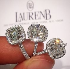 a person holding three diamond rings in their hand with the words lauren b on it