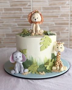 a cake decorated with an animal and giraffe