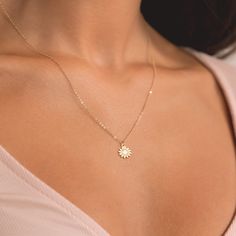 Embrace the warmth of sunshine with our enchanting Mini Sunflower Necklace, meticulously crafted in your choice of gold filled, sterling silver, or rose gold filled. This delicate piece captures the essence of a blooming sunflower, bringing nature's beauty closer to your heart. 🌻 Symbol of Joy: The mini sunflower pendant symbolizes joy, positivity, and the beauty of life. Wear it as a daily reminder to radiate positivity and embrace the simple pleasures. * We use the Highest Quality materials f Sunflower Necklace Silver, Blooming Sunflower, Mini Sunflowers, Initial Disc Necklace, Engraved Bar Necklace, Radiate Positivity, Sunflower Pendant, Bar Necklace Personalized, Sunflower Necklace